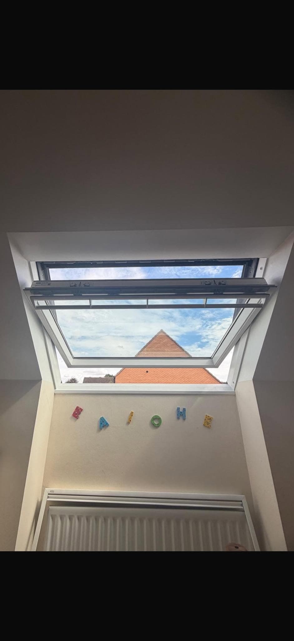 Open roof window viewed from inside a property
