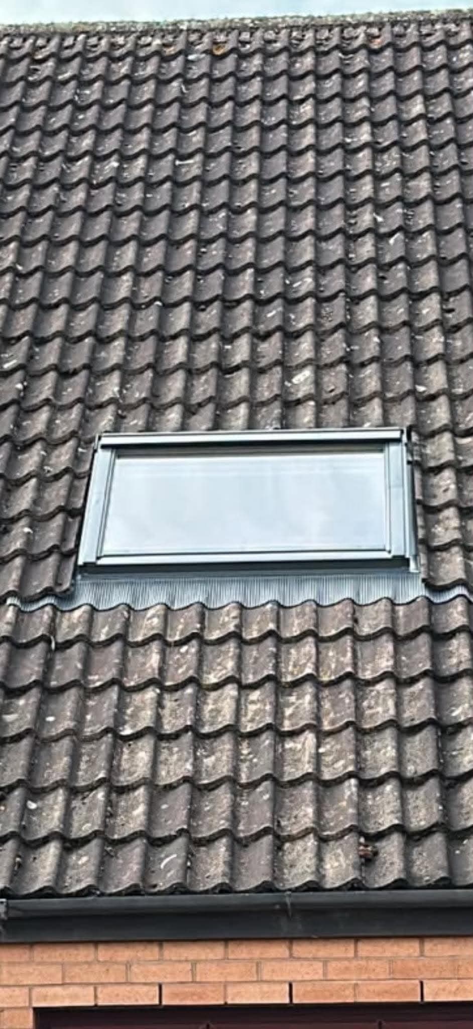Roof window installed in a tiled pitched roof by OGW